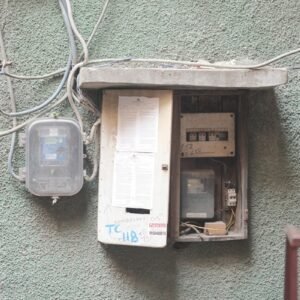 an electrical box attached to the side of a building
